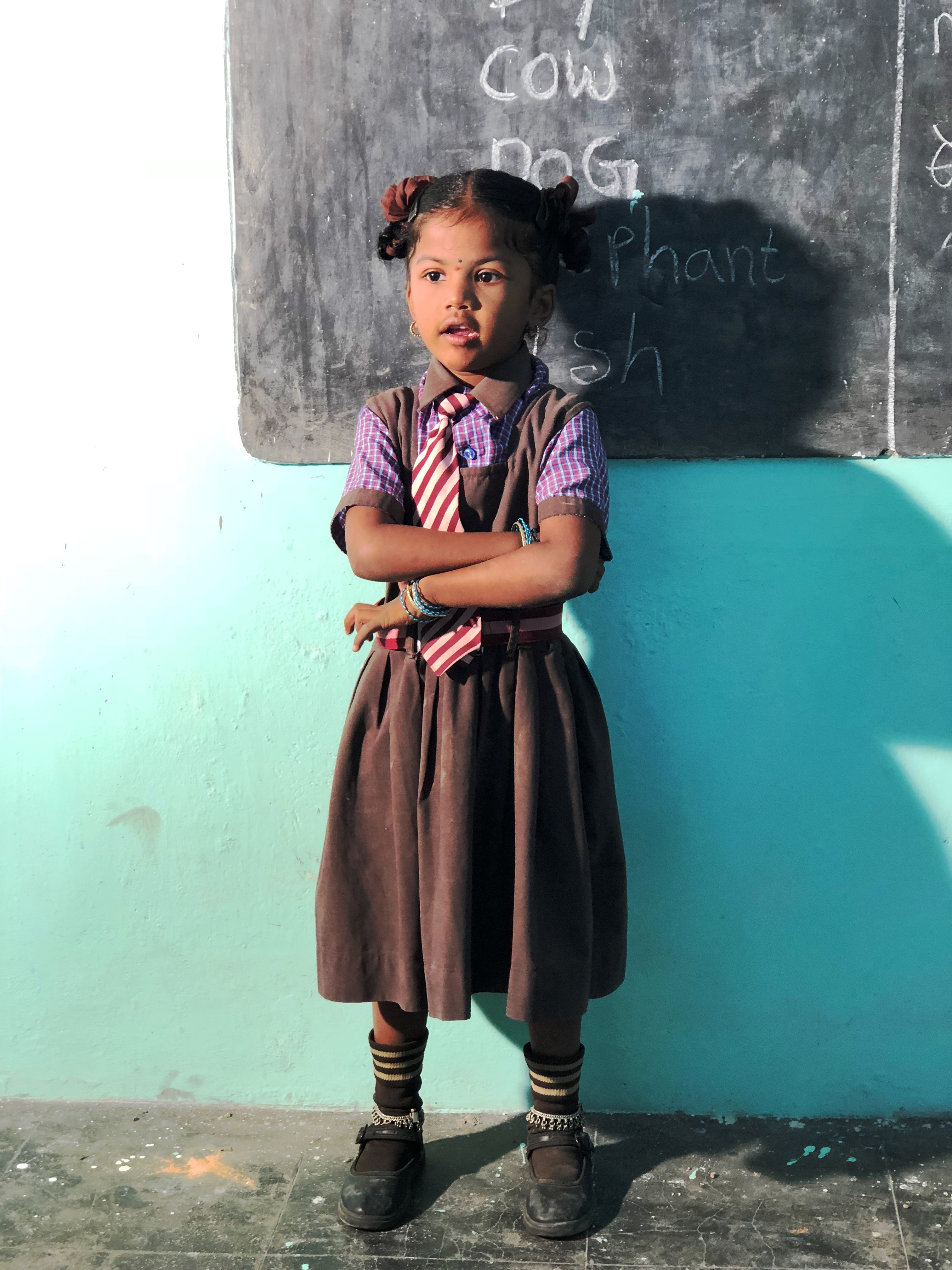 Little Orphan Girl leads class in English recitation