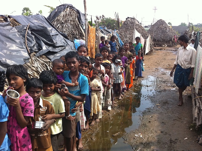 Hungry Children in line for milk