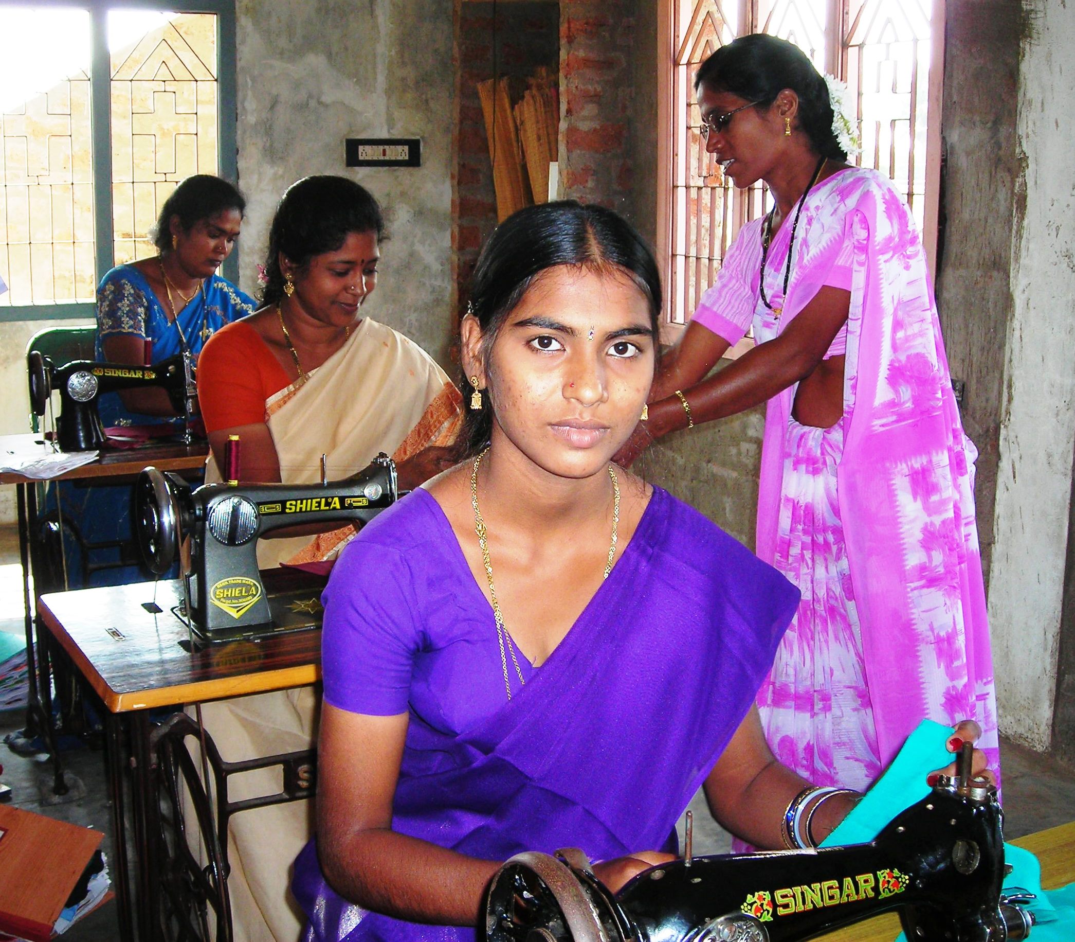 Instructor providing Sewing Training